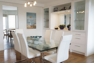 Great room - large contemporary medium tone wood floor and brown floor great room idea in Calgary with white walls and no fireplace