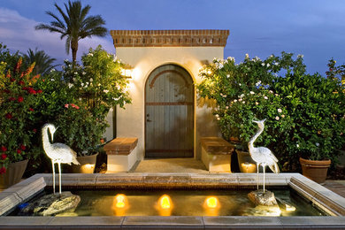 Photo of a southwestern full sun front yard brick landscaping in Phoenix for summer.