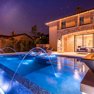 MODERN STYLE POOL AND SPA WITH A BREATHTAKING OUTDOOR KITCHEN & LIVING AREA