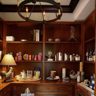 Inspiration för ett stort medelhavsstil kök, med en rustik diskho, luckor med infälld panel, skåp i mörkt trä, bänkskiva i kalksten, flerfärgad stänkskydd, stänkskydd i keramik, rostfria vitvaror, kalkstensgolv och en köksö