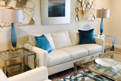 Example of a mid-sized transitional formal and enclosed medium tone wood floor and brown floor living room design in Phoenix with beige walls and no tv