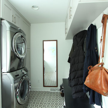 Stacked Washer and Dryer next to Tall Pantry Cabinet