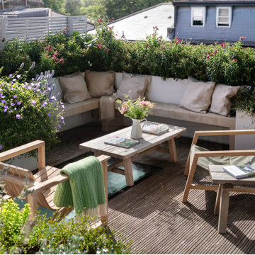 Solid Oak furniture compliments naturally silvered decking.