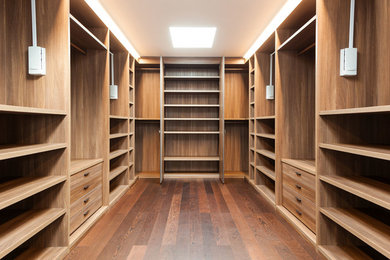 Example of a transitional closet design in Other