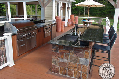 Design ideas for a traditional backyard deck in New York with an outdoor kitchen.