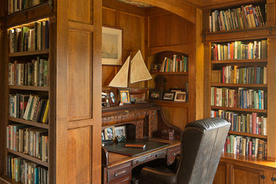 Example of a classic freestanding desk study room design in Santa Barbara with brown walls