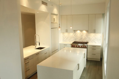 Inspiration for a rustic l-shaped medium tone wood floor open concept kitchen remodel in New York with an undermount sink, flat-panel cabinets, white cabinets, quartz countertops, stone tile backsplash, stainless steel appliances and an island