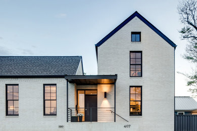 Inspiration for a contemporary white two-story brick exterior home remodel in Little Rock with a shingle roof and a gray roof