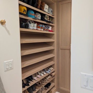Amish Frameless White oak primary bath and closet with painted vanity