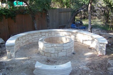 Design ideas for a mid-sized modern partial sun courtyard brick landscaping in Austin with a fire pit for fall.