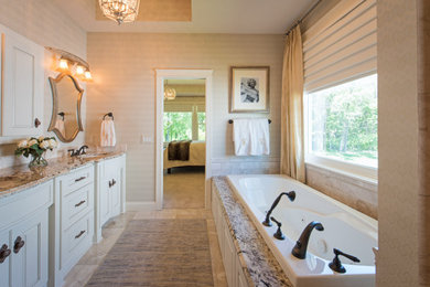 Bathroom - mid-sized traditional master cement tile floor and beige floor bathroom idea in Minneapolis with raised-panel cabinets, white cabinets, a two-piece toilet, beige walls, an undermount sink, granite countertops and beige countertops