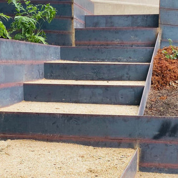 Steel steps and walls with decomposed granite treads