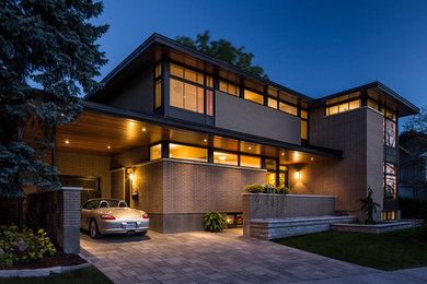 Design ideas for a modern house exterior in Ottawa.