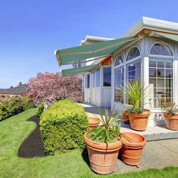NuImage Pro K300 Retractable Awning provides cool shade on conservatory