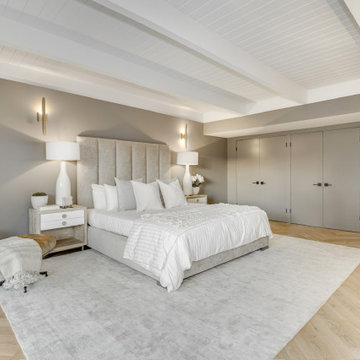 After - Guest Bedroom with a Full Wall of Closet Doors
