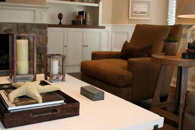 Inspiration for a mid-sized timeless open concept medium tone wood floor family room remodel in Other with beige walls, a standard fireplace, a stone fireplace and a wall-mounted tv