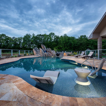 Vineyard view pool with custom slide and boulder work