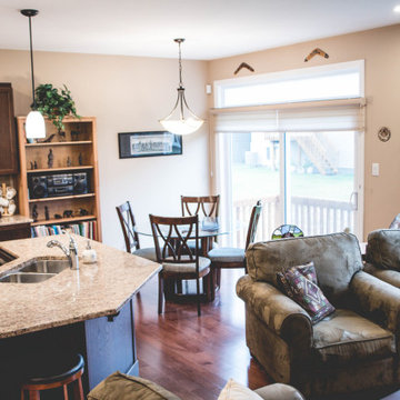 View of the kitchen island, eating area, and living room
