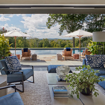 View of the swimming pool with distant mountains beyond.