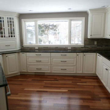 Traditional White Kitchen Remodel with Cook top in the peninsula