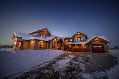 Inspiration for a mid-sized rustic two-story mixed siding exterior home remodel in Calgary