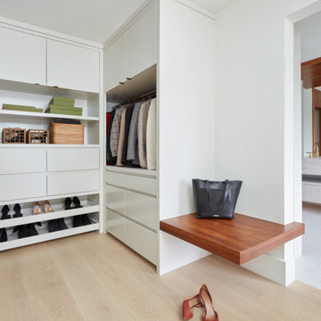 White Walk-In Closet with Floating Teak Wood Bench