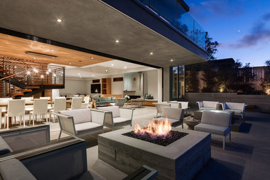 Great room - large contemporary concrete floor and gray floor great room idea with gray walls and a ribbon fireplace