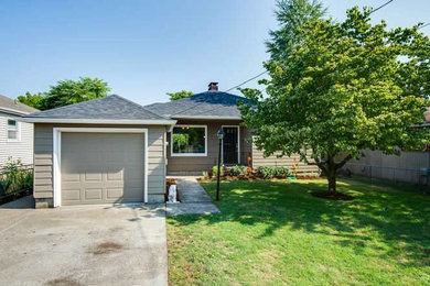 Mid-sized transitional beige one-story wood house exterior photo in Portland with a hip roof and a shingle roof