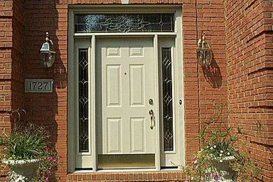Example of a mid-sized transitional entryway design in San Diego with beige walls and a white front door