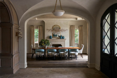 Example of a tuscan dining room design in Dallas