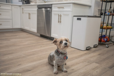 Eat-in kitchen - mid-sized transitional galley porcelain tile and beige floor eat-in kitchen idea in Orlando with recessed-panel cabinets, white cabinets, quartz countertops, multicolored backsplash, marble backsplash, no island and white countertops