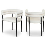 Meridian Furniture - Lavina Upholstered Dining Chair, Cream, Vegan Leather, Set of 2 - Experience the sophisticated allure of the Lavina cream vegan leather dining chair. This chair features a matte black finish and an iron metal frame, ensuring both durability and a modern edge. The contemporary design and luxurious vegan leather elevate your dining space with effortless elegance, making it the perfect centerpiece for gatherings. Enhance your dining area where classic elegance meets contemporary flair.