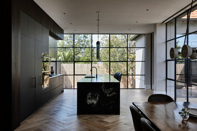 Photo of a contemporary kitchen with with island.