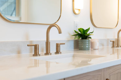 Large master double-sink wet room photo in Calgary with a two-piece toilet, white walls, an integrated sink, quartz countertops, a hinged shower door, white countertops and a built-in vanity