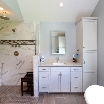 Gray Vanity with Freestanding Tub and Tiled Walkin Shower
