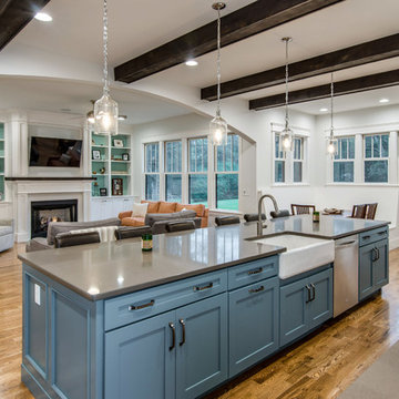 Blue Kitchen Island Cabinets, Apron Sink, and exposed beams
