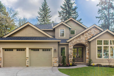 Example of a transitional brown two-story mixed siding exterior home design in Portland with a shingle roof