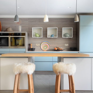 Matt grey & blue kitchen with modern fur bar stools