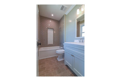 Small trendy kids' beige tile and ceramic tile porcelain tile, brown floor, single-sink and vaulted ceiling bathroom photo in Chicago with raised-panel cabinets, white cabinets, a bidet, beige walls, an integrated sink, quartz countertops, white countertops and a freestanding vanity