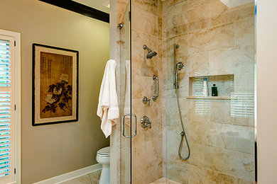 Example of a large transitional beige tile and stone tile limestone floor alcove shower design in Chicago with an undermount sink, recessed-panel cabinets, dark wood cabinets, marble countertops, an undermount tub, a one-piece toilet and beige walls