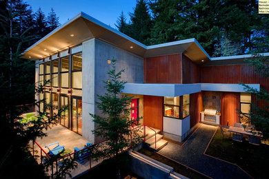 Large trendy gray two-story mixed siding exterior home photo in Portland with a mixed material roof