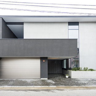 他の地域のモダンスタイルのおしゃれな家の外観 (グレーの外壁、陸屋根、戸建、金属屋根) の写真