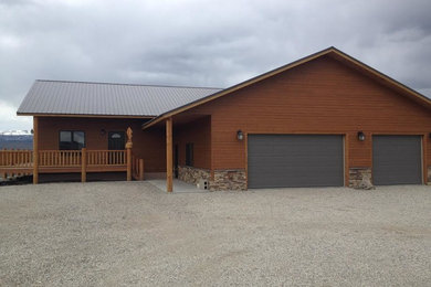 Mid-sized rustic brown one-story mixed siding exterior home idea in Other with a shingle roof