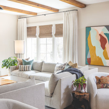 Layered Neutral Family Room with Architectural Beams