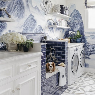 Traditional utility room in San Francisco with beaded cabinets, white cabinets, multi-coloured walls, a side by side washer and dryer and multi-coloured floors.