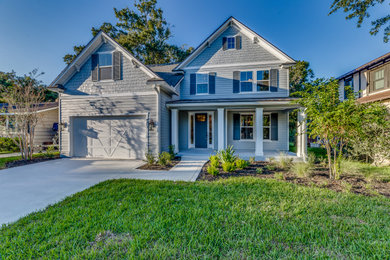 Inspiration for a mid-sized farmhouse gray two-story concrete fiberboard exterior home remodel in Jacksonville with a shingle roof