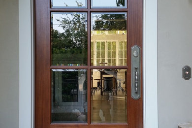Inspiration for an entryway remodel in San Francisco with a dark wood front door