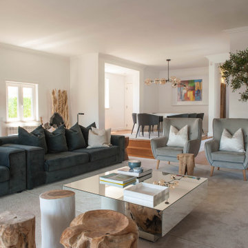 Birre living room with sofa, trunk tables and armchairs