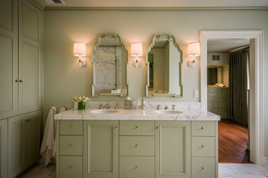 Example of a classic master ceramic tile corner shower design in San Francisco with flat-panel cabinets, green cabinets and green walls
