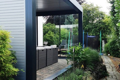 Überdachte, Mittelgroße Moderne Terrasse in Essen